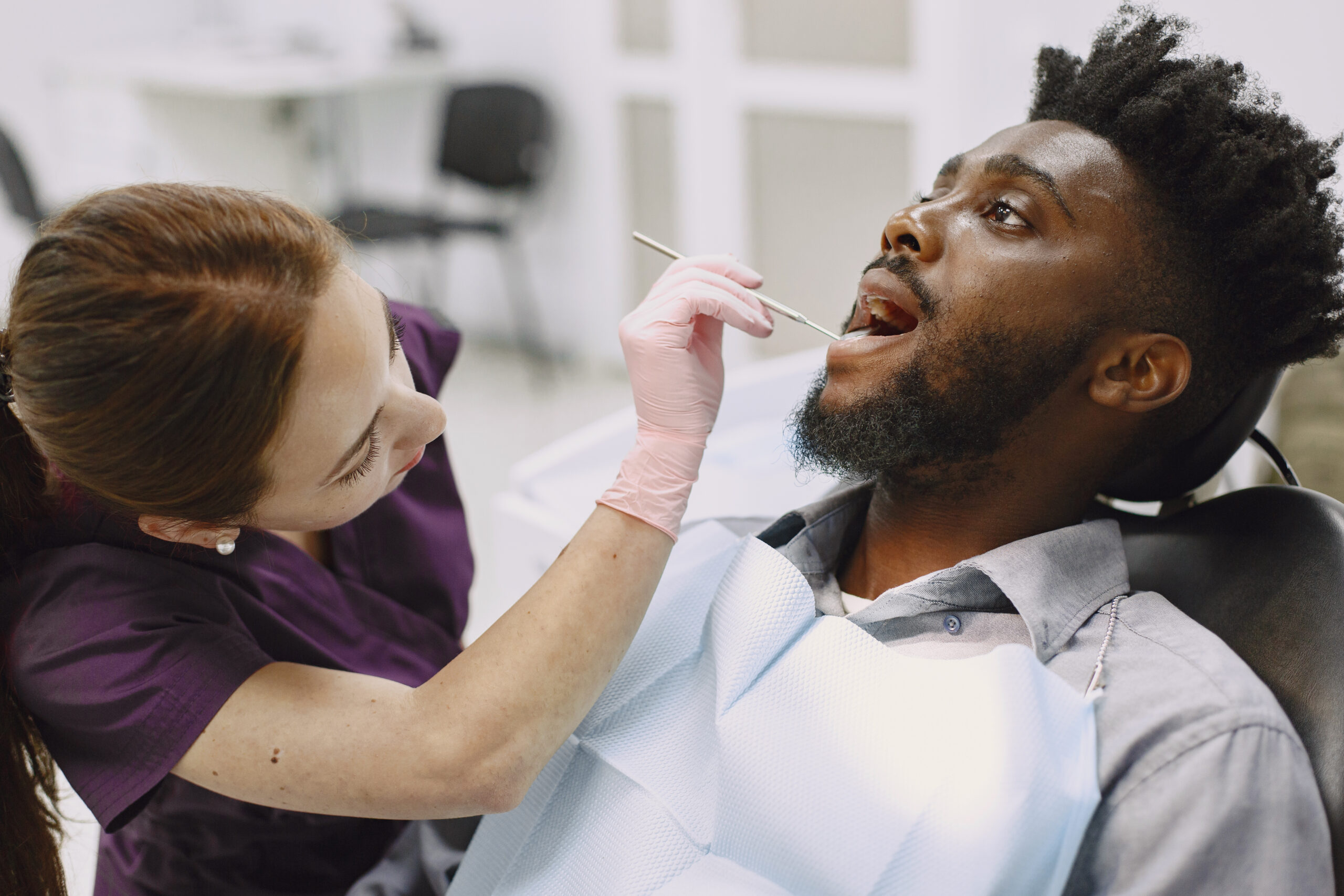 Dentist checking for tooth abcess.