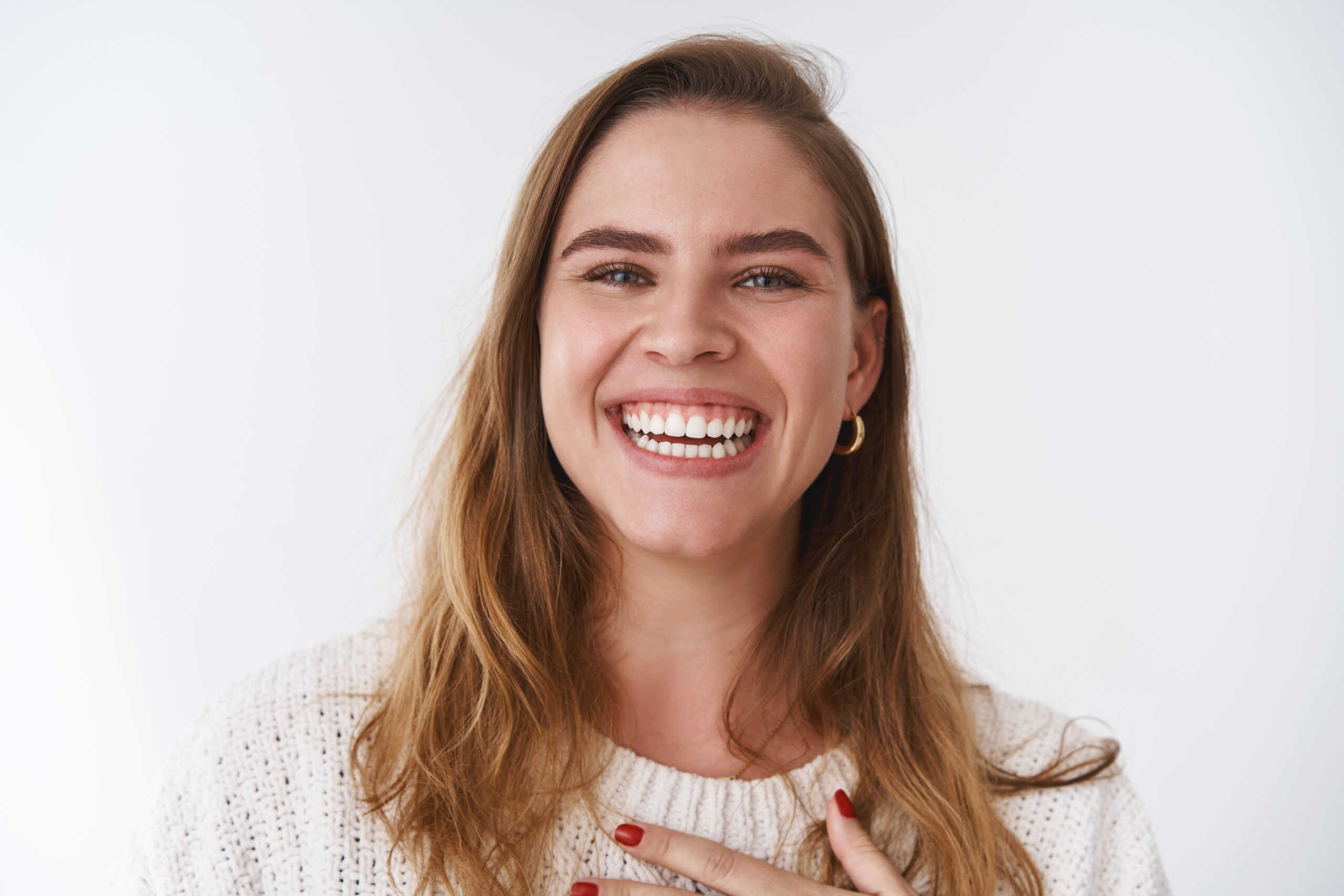 Woman enjoying perfect smile as a result of dental bonding